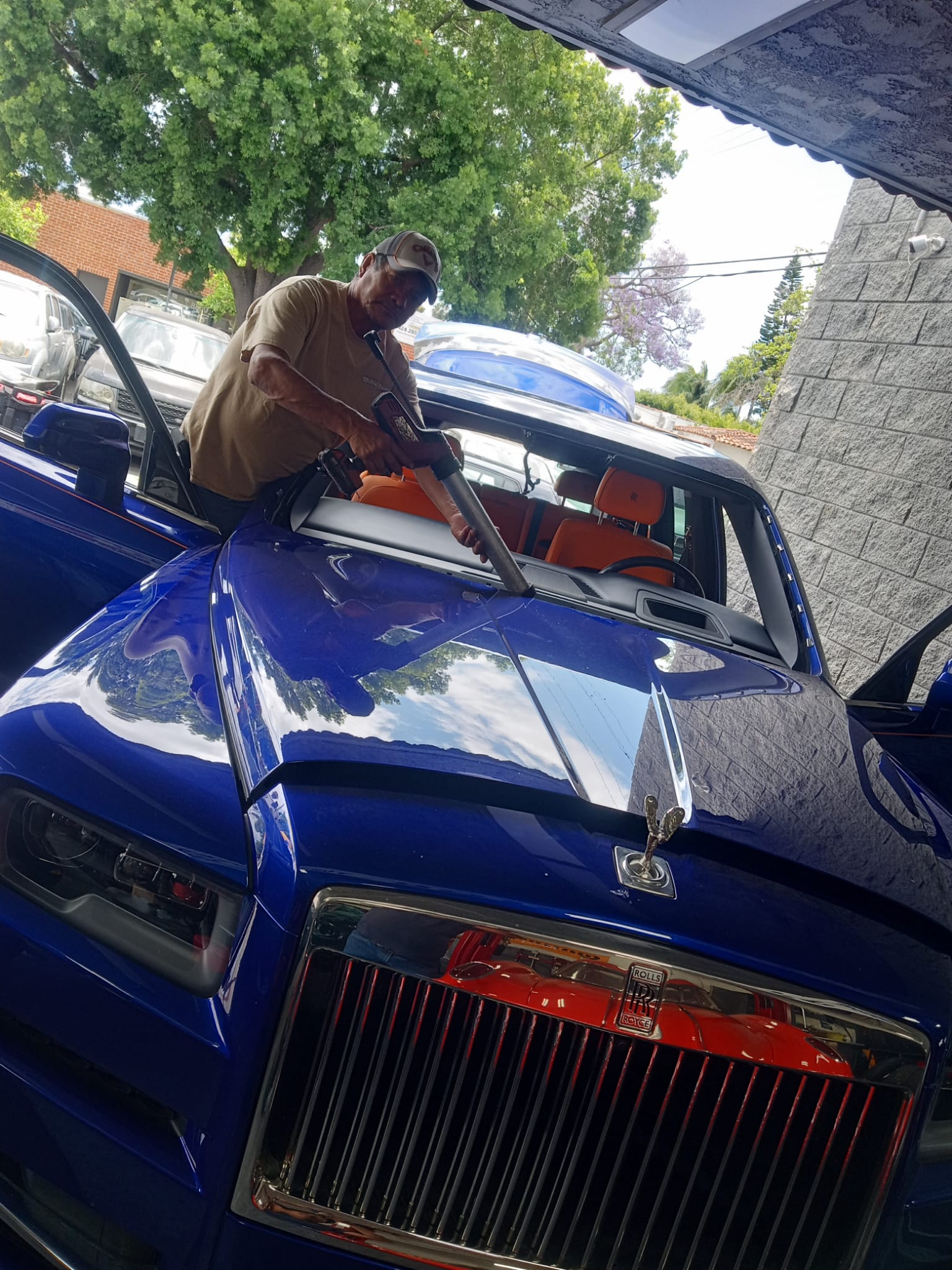 Technician sealing a windshield